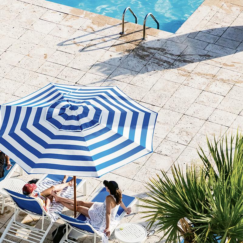 Stripes and sunshine at The Beach Club at Charleston Harbor Resort & Marina  The vivid blues continue in the plush living room-style lobby.