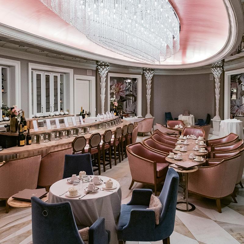 The pink bar and tabletops in Camellias feature marble salvaged from the Charleston County Library previously located on the site.